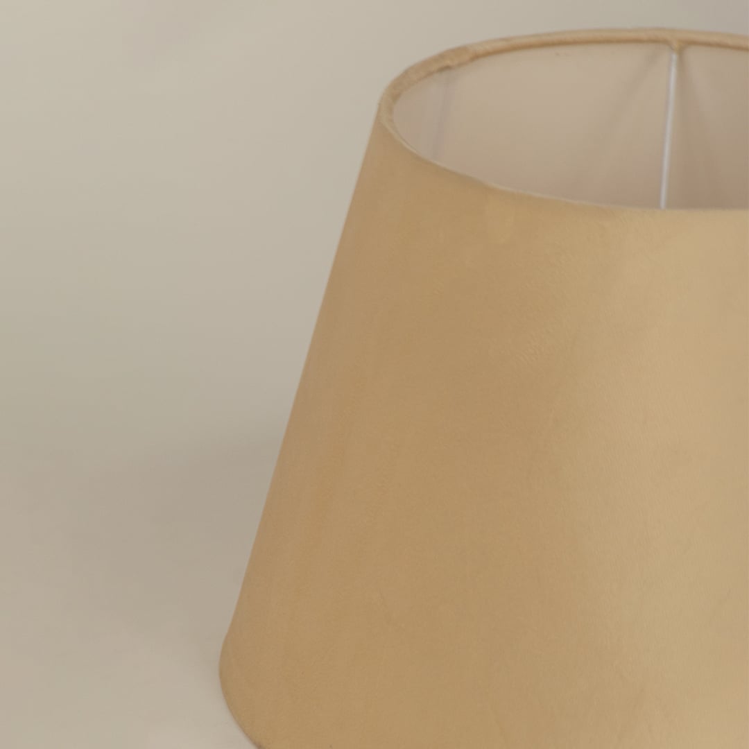 Close view of the beige velvet lampshade showing its soft plush surface and refined tapered form with smooth detailing.