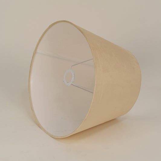 Beige fabric lampshade with smooth finish on white background ideal for table lamp bedroom and living room decor.