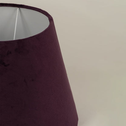 Close detailed view of the plum velvet lampshade showing its soft rich texture and smooth tapered finish with clear fabric detailing.