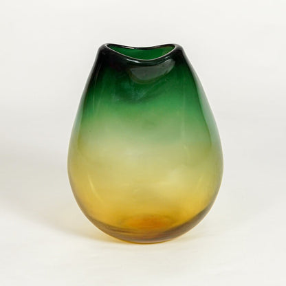 Green amber decorative glass vase on white background modern home decor accent piece for table shelf console styling interior.