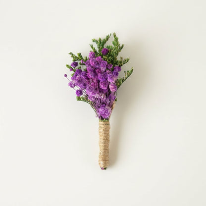 Dried floral stem bouquet with rich purple blossoms and green foliage on white background highlighting natural texture handcrafted charm and elegant decor styling appeal.
