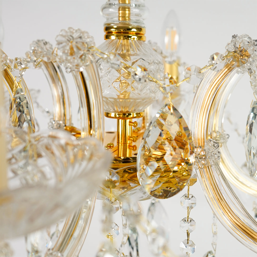 Closeup image of elegant crystal chandelier for luxury living room decor styling with polished finish.
