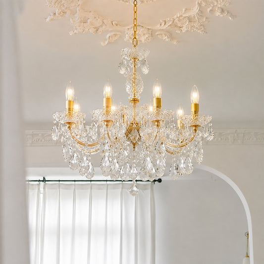 Lifestyle image of eight light candle style chandelier for luxury ceiling decor styling with a modern elegant finish.