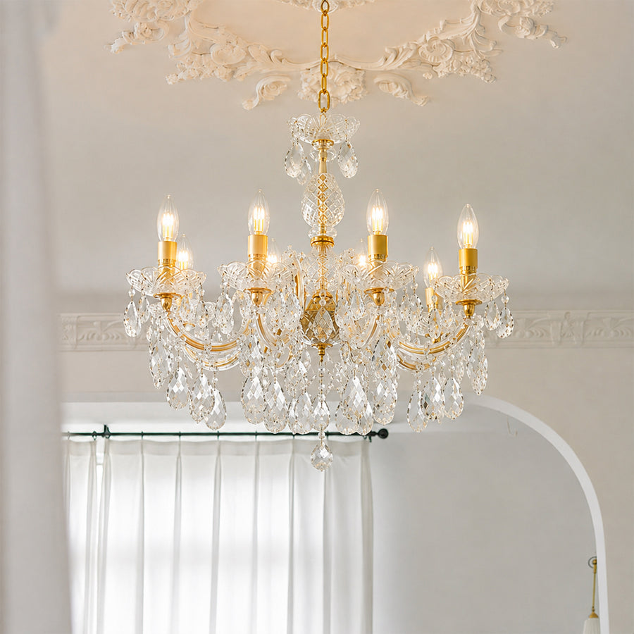 Lifestyle image of eight light candle style chandelier for luxury ceiling decor styling with a modern elegant finish.