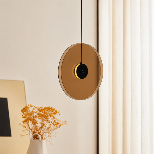 Lifestyle image of vertical gold glass double disk pendant light for modern room decor styling with elegant gold finish.