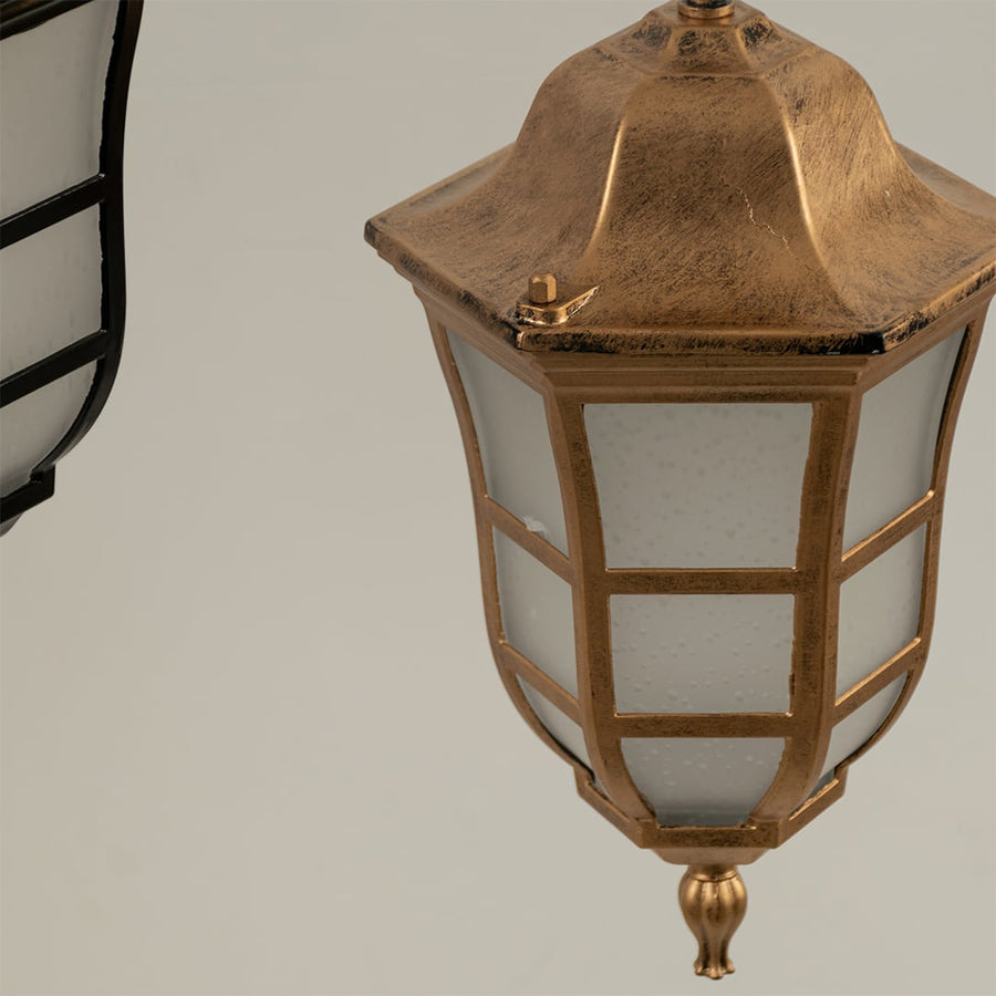Close up view of the classic black metal lantern hanging light showing the grid detail on the frosted glass and the chain suspension.