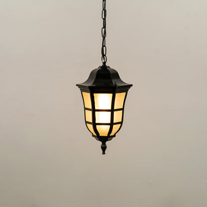 Black metal hanging outdoor lantern with glass panels glowing on white background ideal for gate entrance and exterior lighting decor.