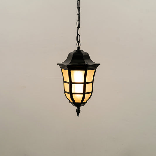 Black metal hanging outdoor lantern with glass panels glowing on white background ideal for gate entrance and exterior lighting decor.