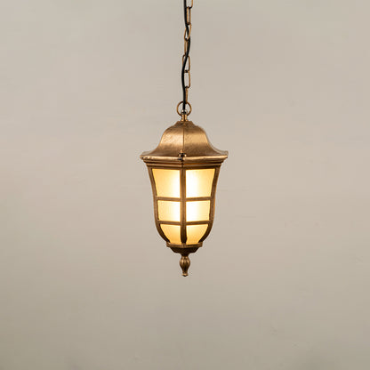 Gold metal hanging outdoor lantern with cylindrical glass design glowing on white background suitable for porch entrance and exterior decor lighting.