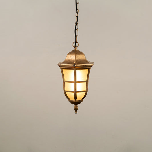 Gold metal hanging outdoor lantern with cylindrical glass design glowing on white background suitable for porch entrance and exterior decor lighting.