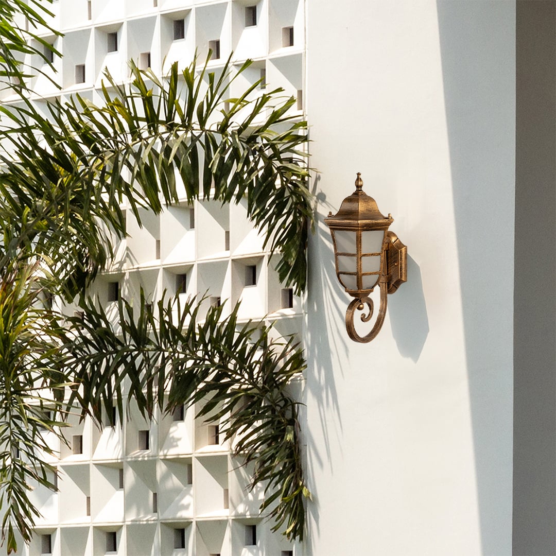 Elegant gold metal outdoor wall lantern light on illuminating a contemporary exterior facade with warm glow ideal for porch balcony patio and entryway Decor.