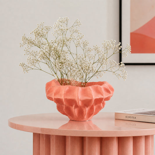Coral textured ceramic planter bowl with dried flowers placed on table for elegant modern home decor.
