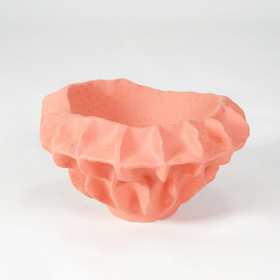 Pink textured ceramic bowl for stylish coffee table placement and modern indoor home decor styling centerpiece accent.