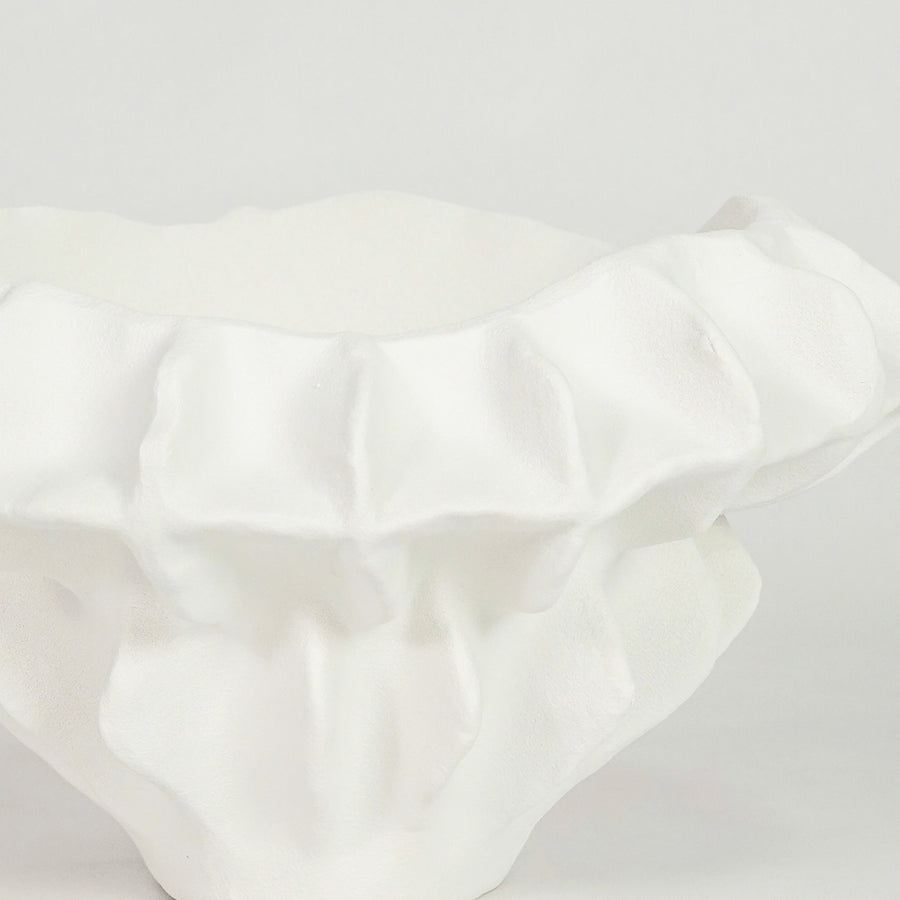 Closeup image of white ceramic textured decor bowl for modern dining table styling with elegant artistic finish.