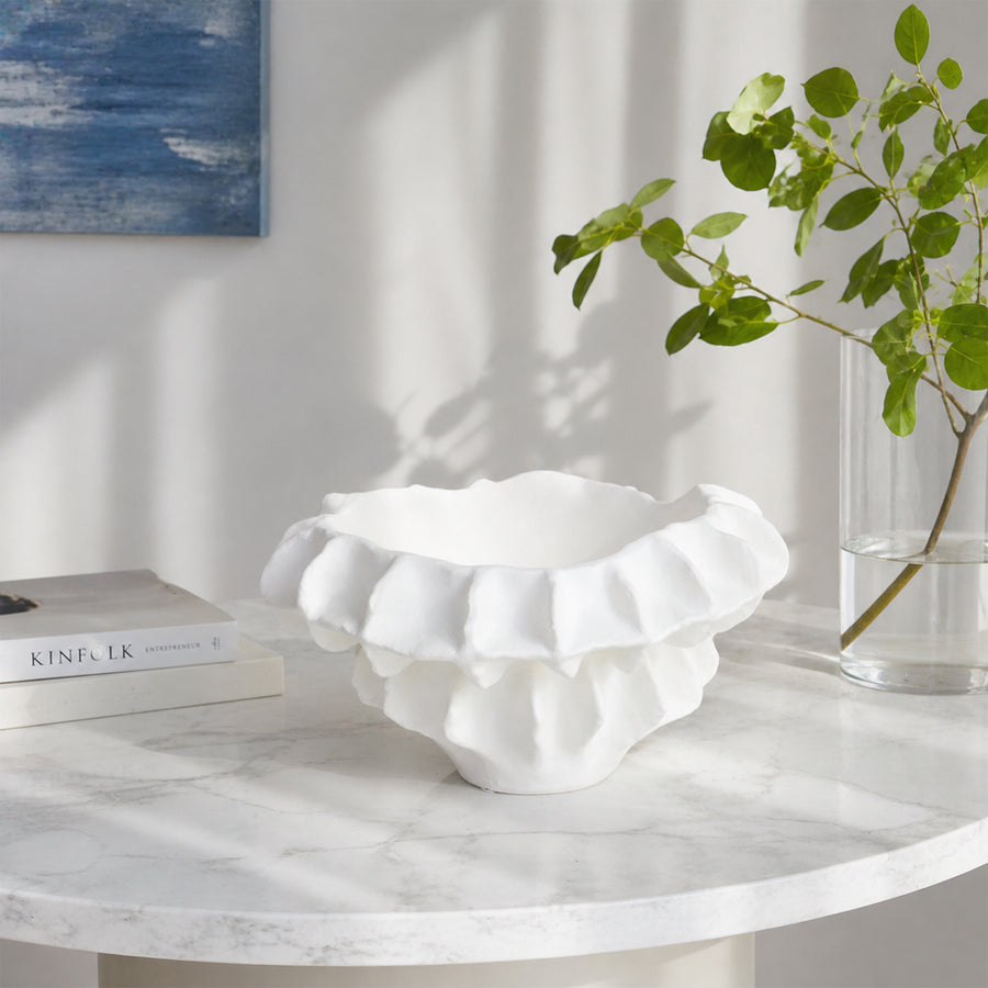 White textured ceramic planter bowl placed on marble table for elegant modern living room decor styling.