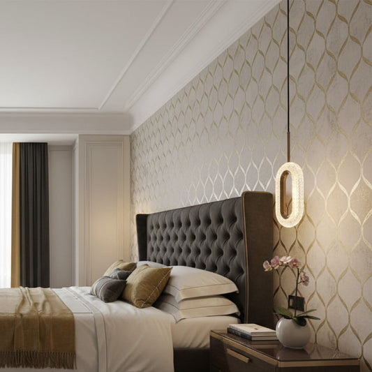 Wall mounted ring light in metal finish placed beside bed adding soft ambient glow and modern accent to contemporary bedroom decor.