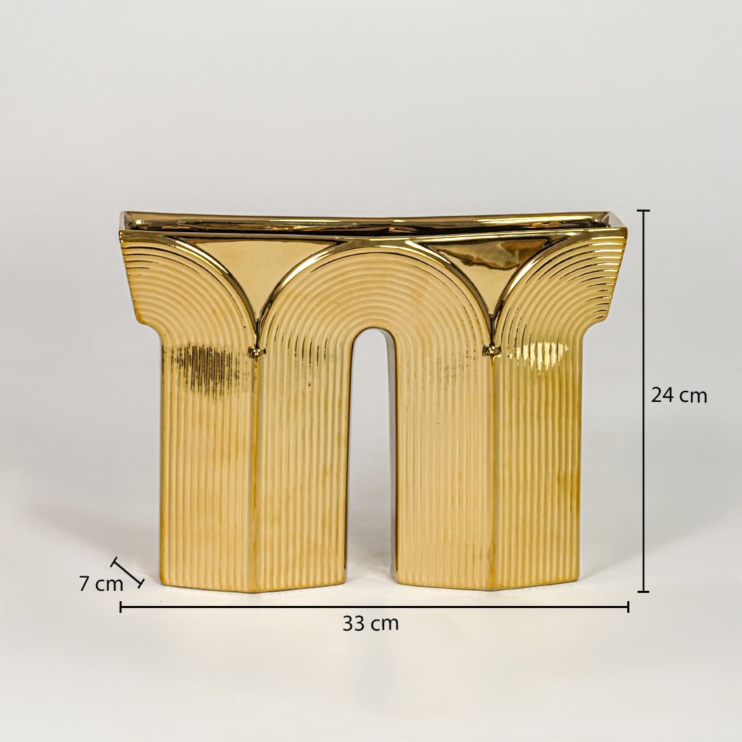 Gold metal decorative sculpture size 24 cm height 33 cm width 7 cm depth modern showpiece for console table styling.