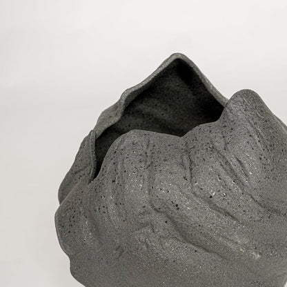 vintage cast black ceramic vase closeup