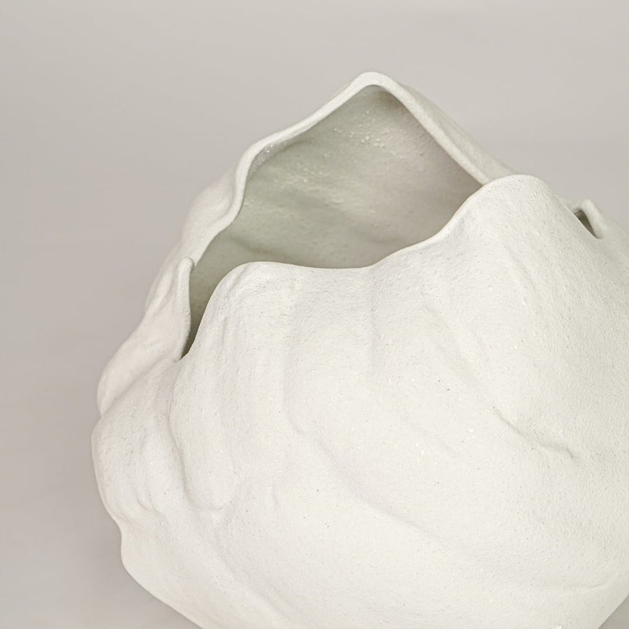 vintage cast white ceramic vase closeup
