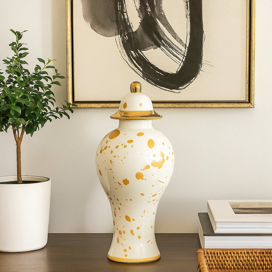 White ceramic jar with yellow detailing styled on console table adding classic charm and refined elegance to home Decor.