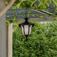 Classic black metal outdoor hanging lantern for gazebo pergola garden and covered patio with warm ambient lighting.