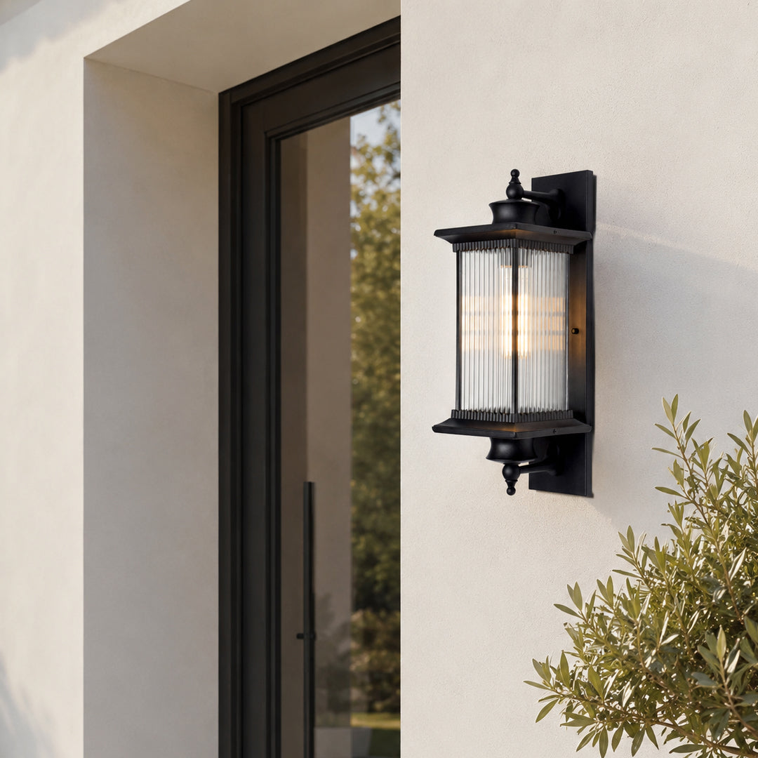 Modern black metal outdoor wall light for porch entrance garden and exterior walls with elegant warm ambient lighting.