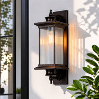 Classic black metal outdoor wall lantern for porch entrance balcony and exterior walls with warm ambient lighting.