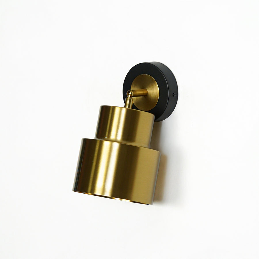 Gold adjustable wall spotlight with black base modern wall lamp for bedroom living room ambient lighting decor.