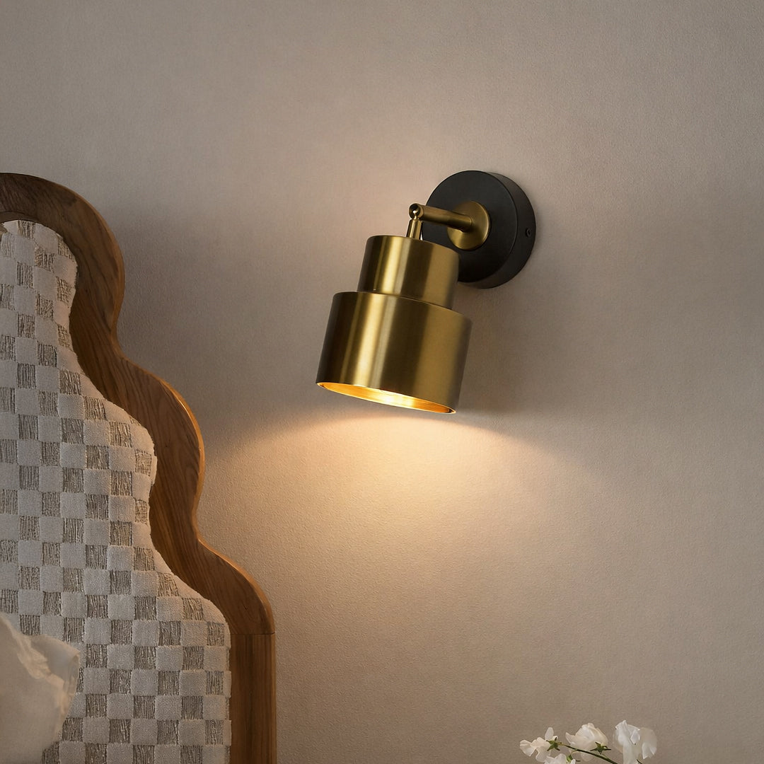 Gold metal wall spotlight with black base modern adjustable wall lamp for bedroom living room decor focused lighting.