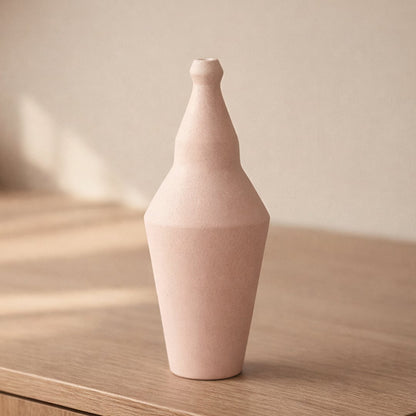 Pink ceramic decorative vase placed on table modern flower vase for living room shelf console home decor styling.
