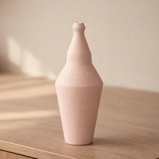 Pink ceramic decorative vase placed on table modern flower vase for living room shelf console home decor styling.