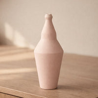 Pink ceramic decorative vase placed on table modern flower vase for living room shelf console home decor styling.