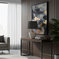 Grey ceramic table lamp with pleated fabric shade styled on a console table creating warm contemporary ambient lighting.