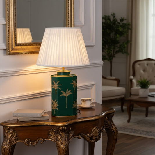 Lifestyle image of green metal table lamp with white pleated shade for elegant living room decor styling and home lighting.