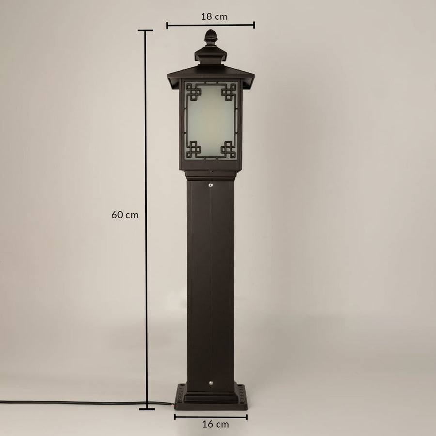A black outdoor bollard lamp on a white background showing all dimensions clearly marked with a height of 60 cm a top width of 18 cm and a base width of 16 cm providing precise size details.
