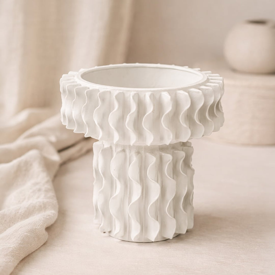 White ceramic frilled large vase with flowing layered design isolated on white background for modern tabletop decor.