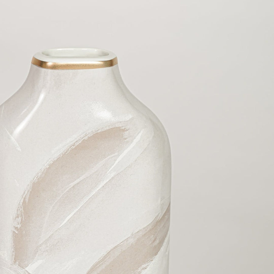 White ceramic decorative vase with elegant beige leaf pattern and gold rim perfect for dried floral display and interior decor.