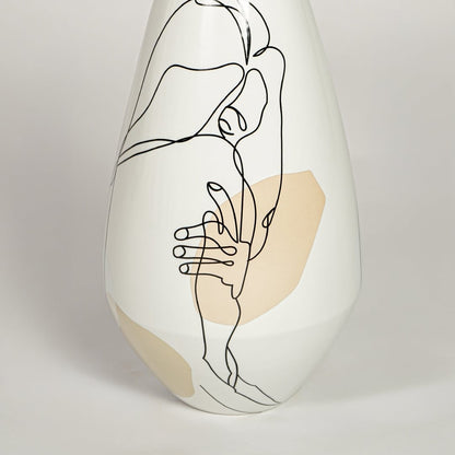 Close view of bottleneck porcelain vase highlighting abstract face line art and smooth glossy finish.