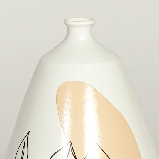 Close up view white ceramic art vase showing abstract face line drawing glossy finish decorative ceramic accent.