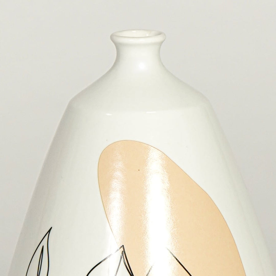 Close up view white ceramic art vase showing abstract face line drawing glossy finish decorative ceramic accent.