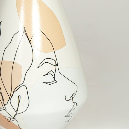 Close up view artistic ceramic vase showing minimal face illustration smooth finish decorative accent for home styling.