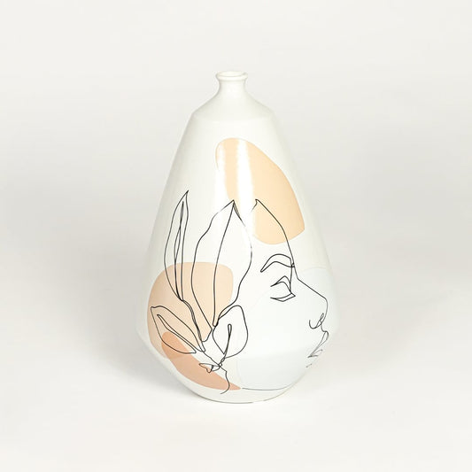 White decorative ceramic art vase on white background modern home decor accent piece for console table styling.