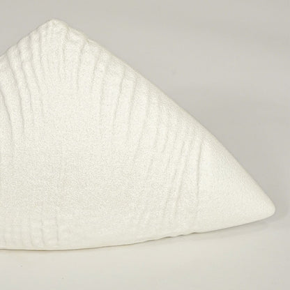 Close view of white ceramic decor sculpture showing textured surface finish and curved sculptural form.