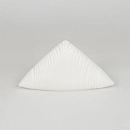 Modern white decorative ceramic showpiece isolated clean background stylish home decor accent piece.