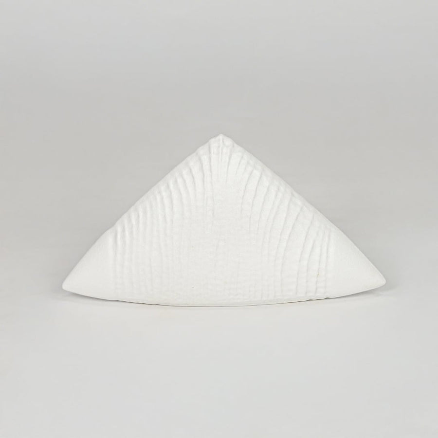 Modern white decorative ceramic showpiece isolated clean background stylish home decor accent piece.
