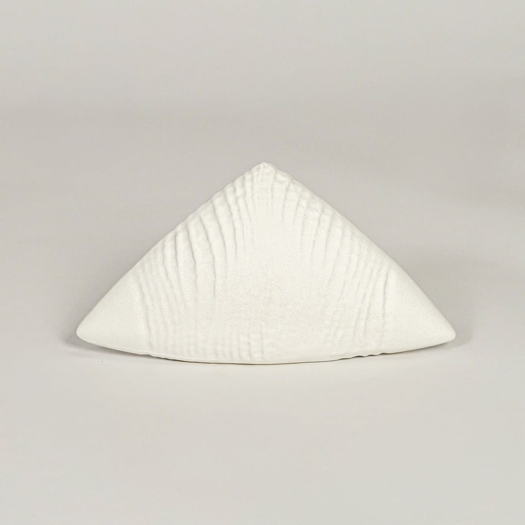 White ceramic abstract decor sculpture with smooth matte texture designed for table shelf or console placement.