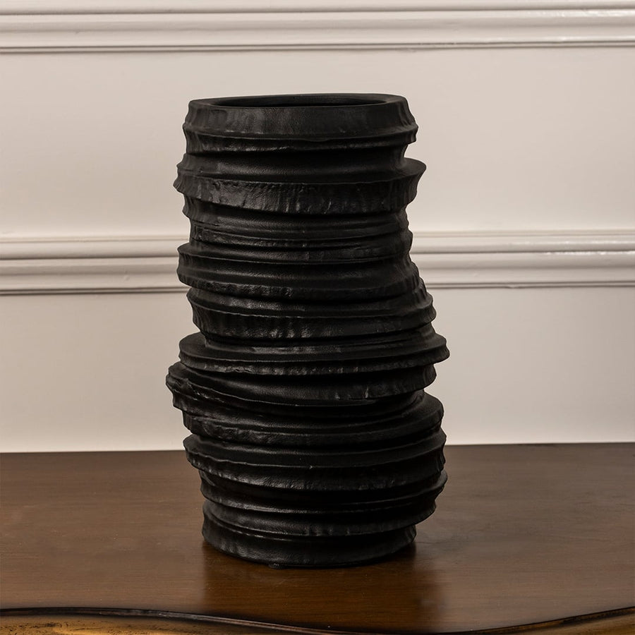 Aero black ceramic vase displayed on a white background showcasing its handcrafted stacked texture and matte finish for modern home styling.