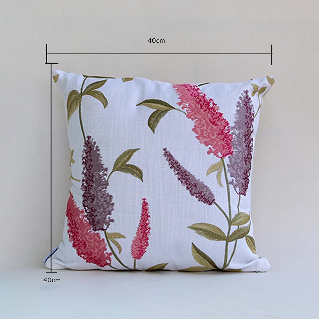 Soft cotton cushion cover with pink and purple floral embroidery displayed with dimensions of 40 cm by 40 cm providing a lively nature inspired décor accent with a breathable gentle and skin friendly material.