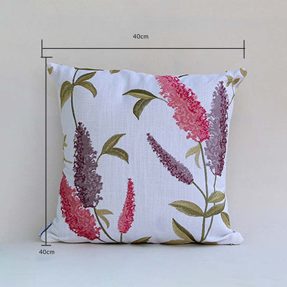 Soft cotton cushion cover with pink and purple floral embroidery displayed with dimensions of 40 cm by 40 cm providing a lively nature inspired décor accent with a breathable gentle and skin friendly material.