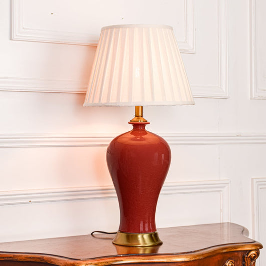 wine red ceramic table lamp light on white background